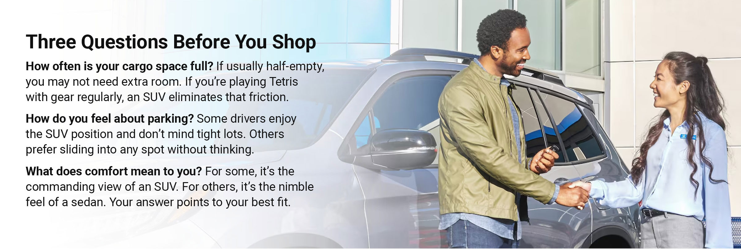 Customer shaking hands with a car salesperson next to an SUV at a dealership