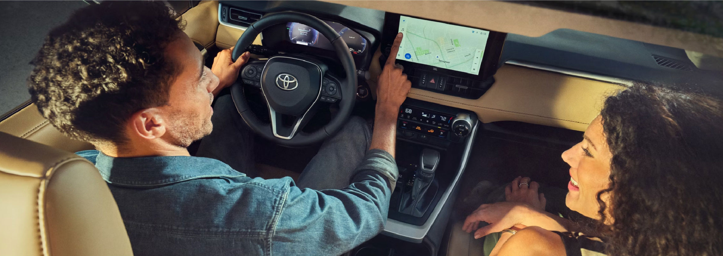 A couple having a conversation inside a Toyota vehicle