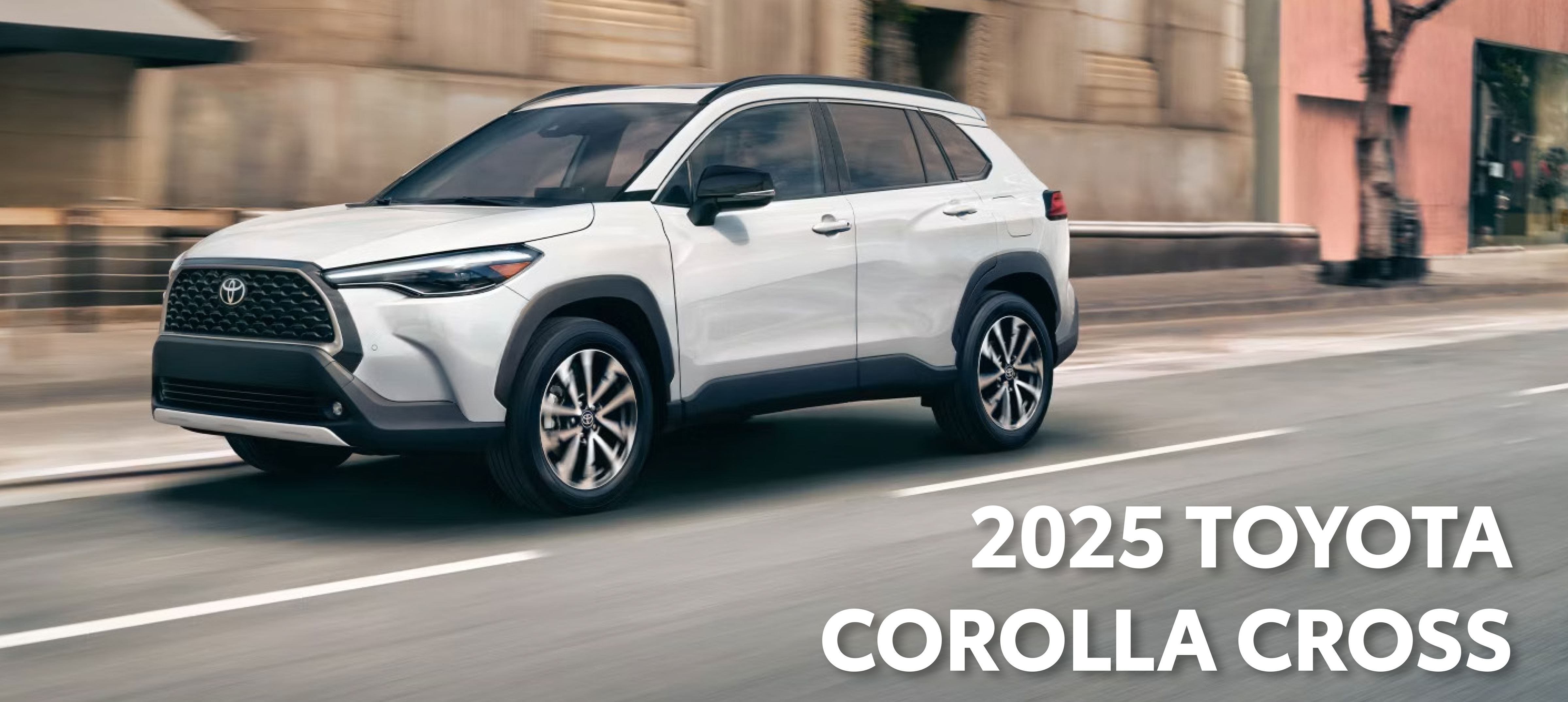 2025 Corolla Cross driving on the road.