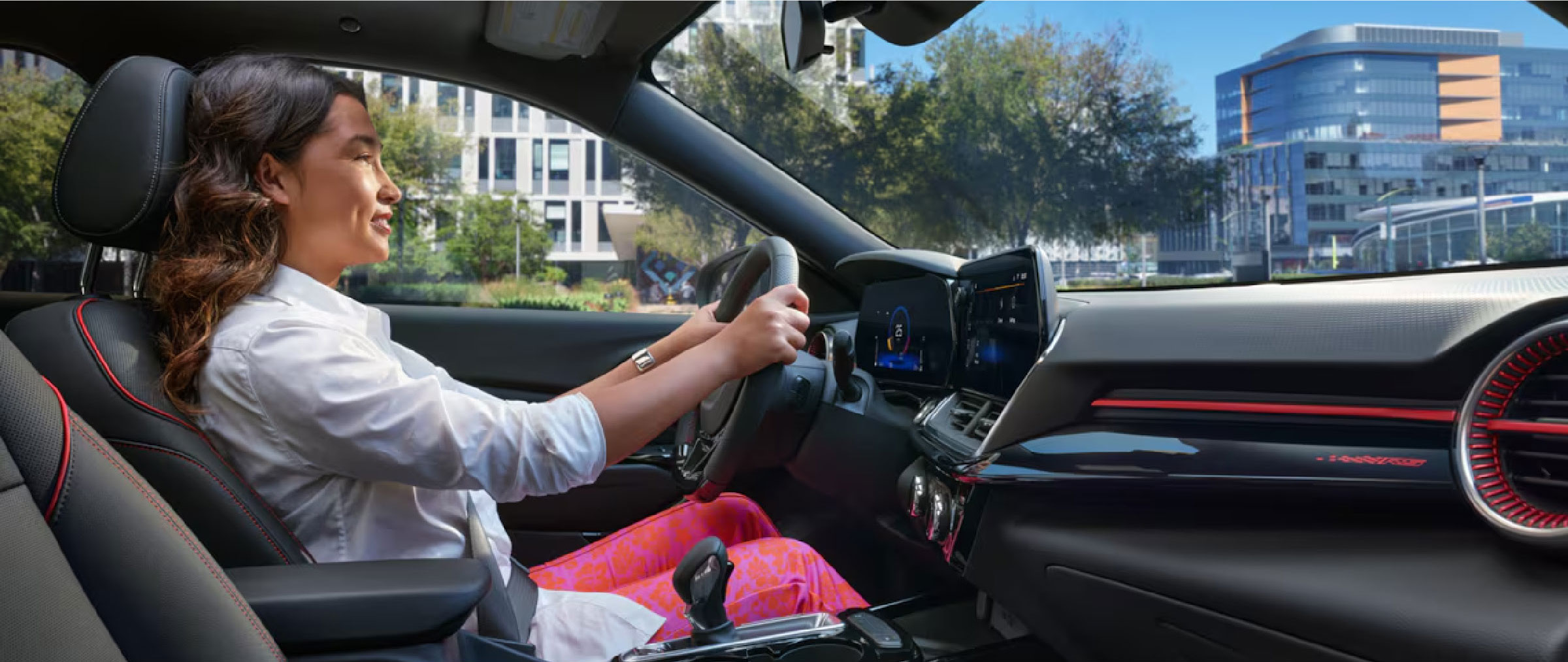 a woman driving a Chevrolet vehicle