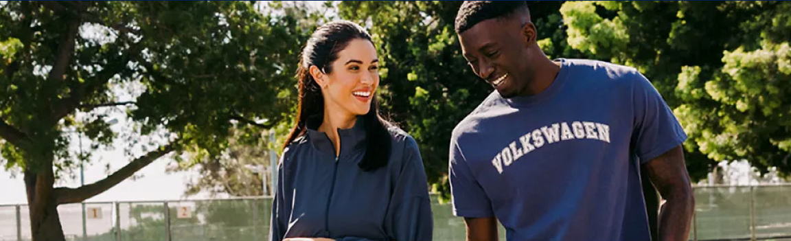 Volkswagen enthusiasts walking outdoors highlighting community engagement, brand loyalty, and the Volkswagen ownership lifestyle