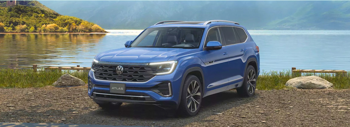 Volkswagen Atlas SUV parked near a scenic lake