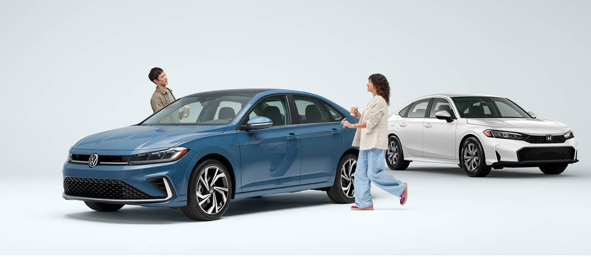 Volkswagen Jetta and Honda Civic sedans side by side comparison with shoppers
