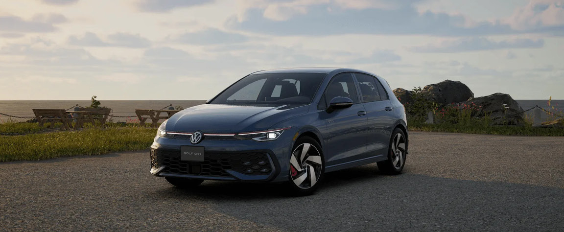 2025 Volkswagen Golf GTI driving through downtown Greenville, SC