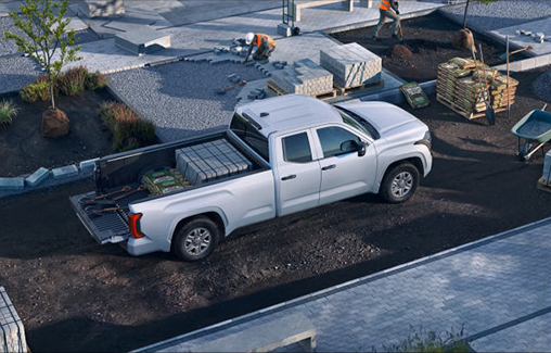 Toyota Tacoma loaded with construction materials at a jobsite demonstrating cargo capacity, durability, and everyday work-truck utility