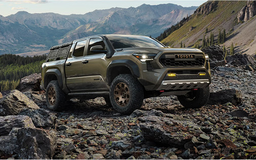 Toyota Tacoma TRD Pro positioned on rocky terrain showcasing advanced off-road engineering, trail capability, and rugged design