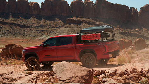 Toyota Tacoma TRD Pro navigating a desert trail with overlanding gear highlighting off-road performance, adventure readiness, and exploration-focused versatility
