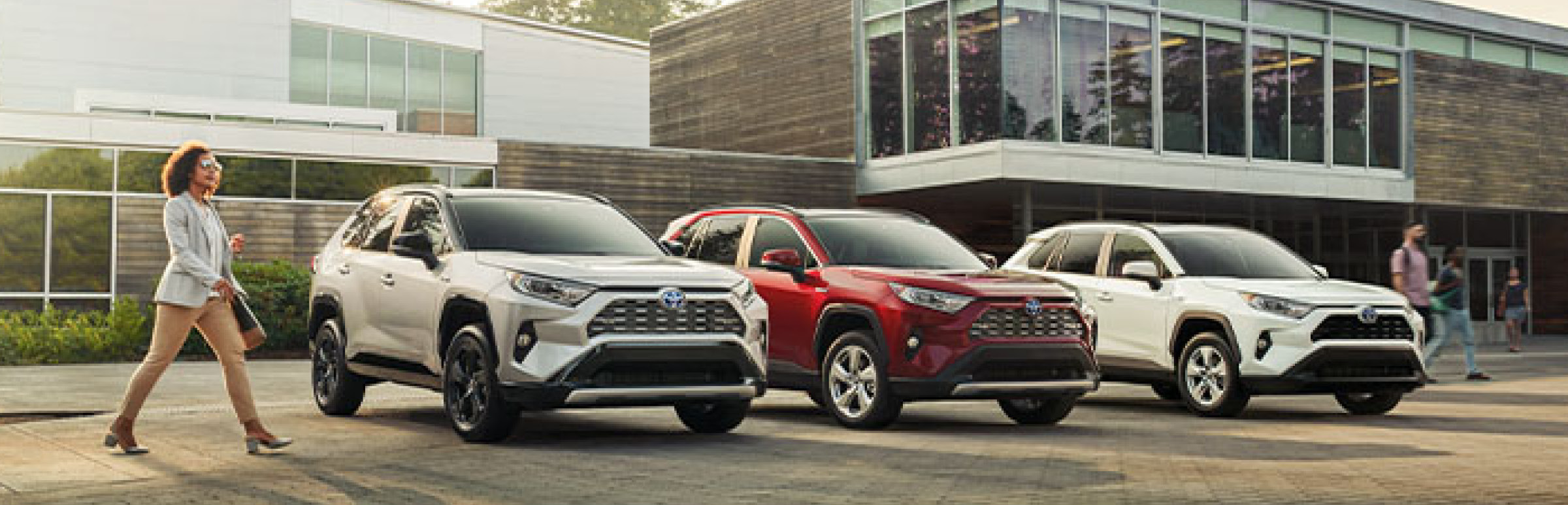 3 Toyota RAV4 lining up in a parking lot