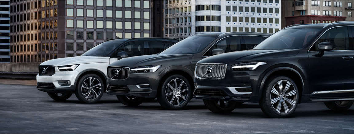 Volvo SUV lineup parked in an urban setting with multiple models