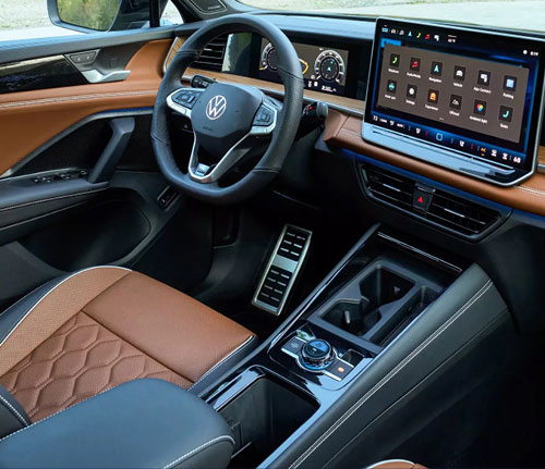 2026 Volkswagen Tiguan interior featuring touchscreen infotainment system, digital gauge cluster, and premium seating