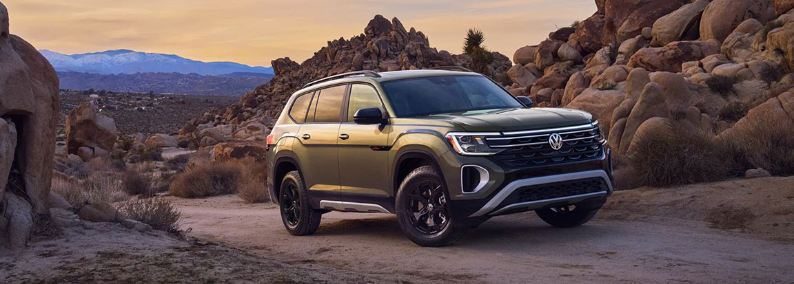 Volkswagen Atlas SUV parked in a desert landscape highlighting rugged styling and family adventure capability