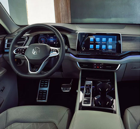 Volkswagen Atlas interior featuring digital cockpit, touchscreen infotainment system, and spacious cabin design