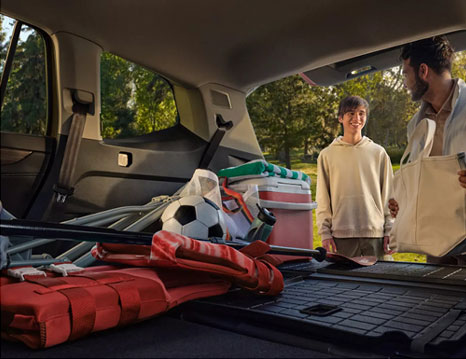 Volkswagen Atlas cargo area loaded with sports gear and family essentials demonstrating flexible storage space