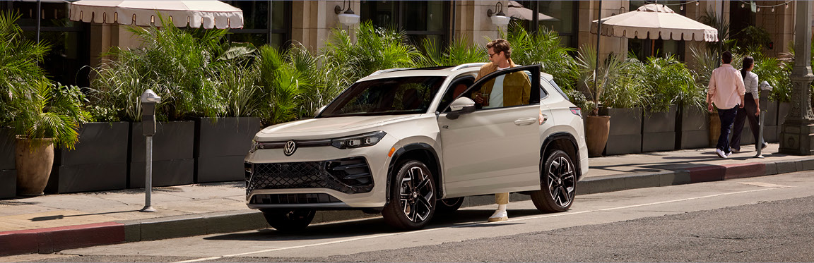 Volkswagen Taos parked in an urban setting, highlighting compact SUV convenience, city-ready design, and everyday practicality