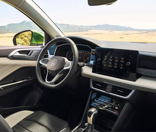 Volkswagen SUV interior featuring a digital cockpit, touchscreen infotainment system, and driver-focused cabin design