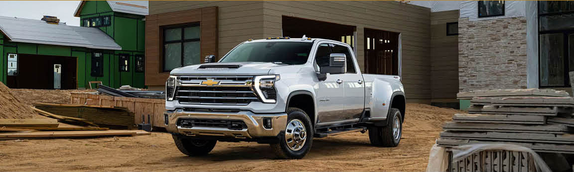 Chevrolet Silverado HD pickup truck parked at a residential construction site
