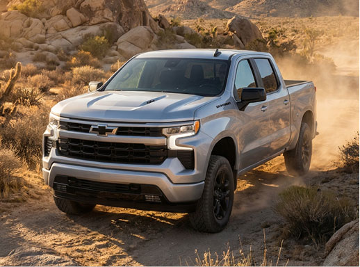 Chevrolet Silverado off-road truck navigating rugged desert terrain, highlighting trail-ready capability, durability, and adventure-focused performance