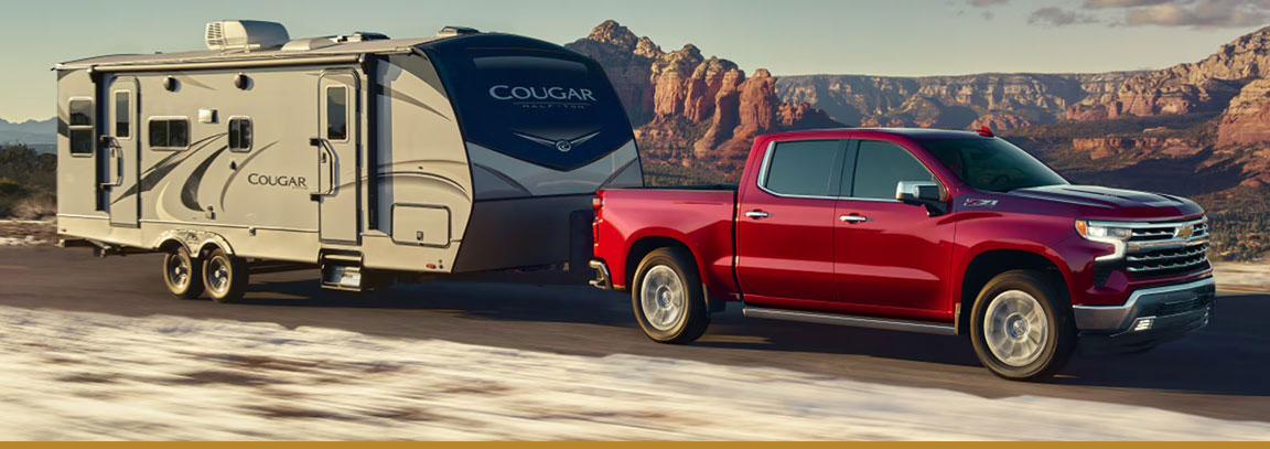 Silverado and F-150 facing one another. 